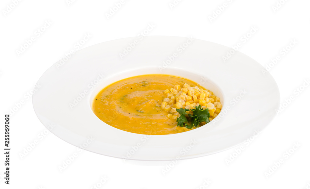 White plate with corn mash soup White plate with corn mash soup
