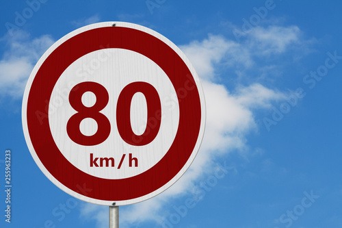 Red and white 80 km speed limit sign