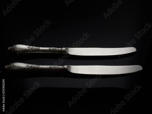 Three cupronickel forks on a black background photo