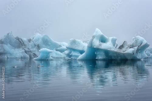 Jokulsarlon Glacier Lagoon of Iceland, amazing nature with blue ice and reflection in the water, popular tourist attraction
