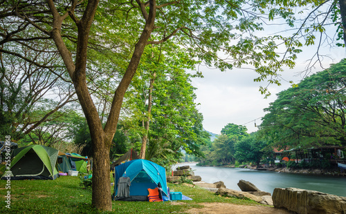 Fényképezés Camping and tent near the river