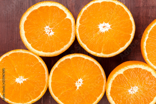 An overhead closeup photo of fresh orange halves