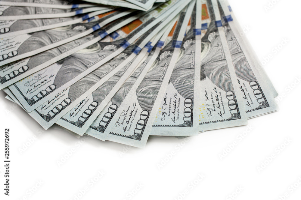 fan of new hundred dollar bills isolated on white background