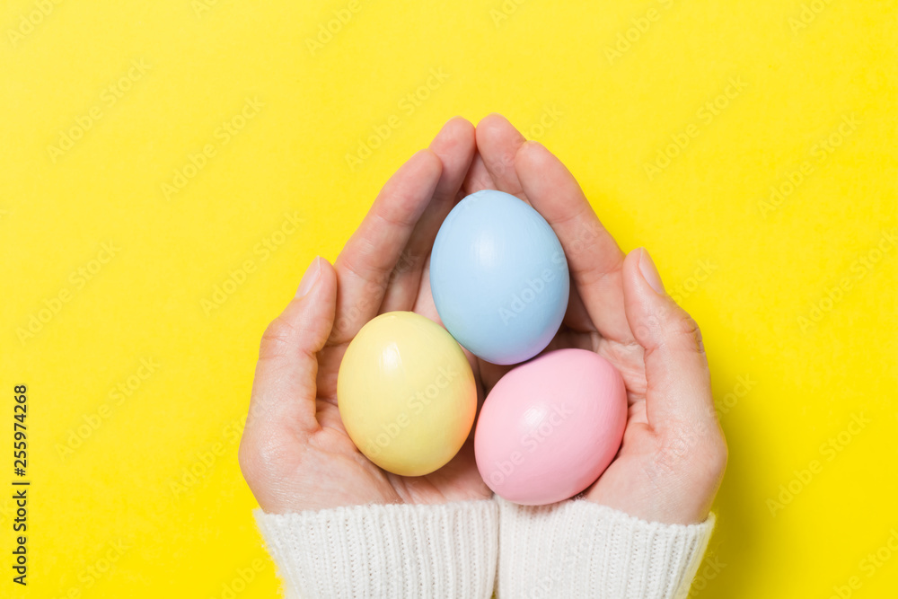 colorful easter eggs on yellow background colorful easter eggs on yellow background