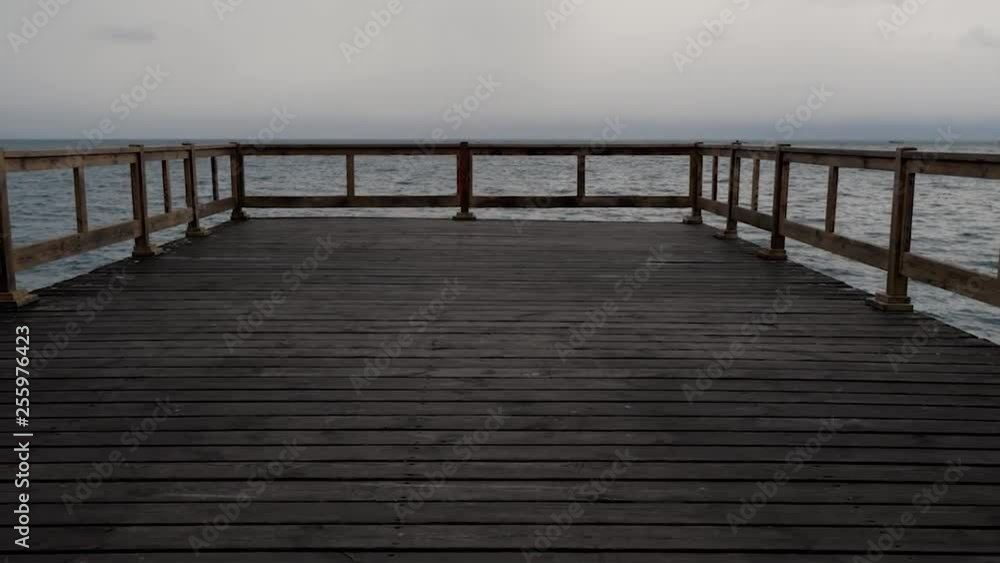 First person walk on a wooden pier overlooking the Black Sea on a cloudy day First person walk on a wooden pier overlooking the Black Sea on a cloudy day
