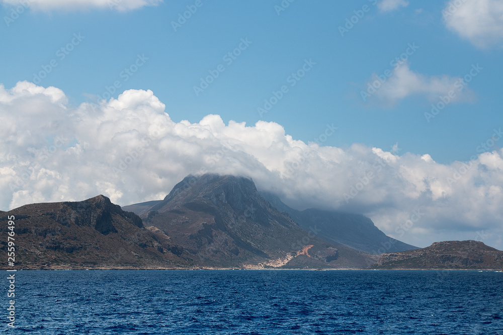 Sea. Mountains. Rocks. Clouds. View of the coast.