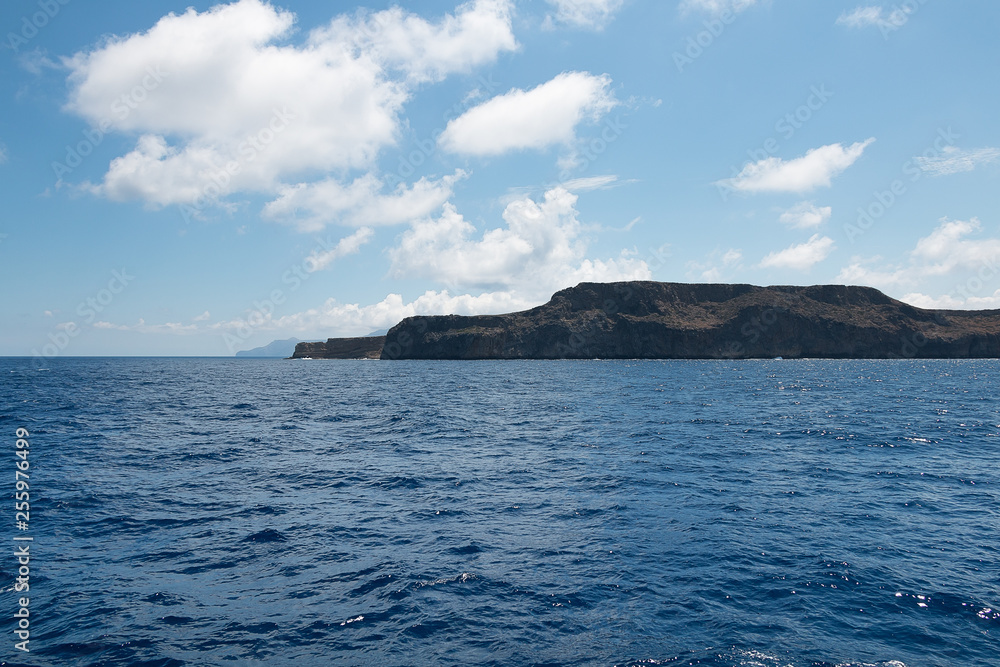 Sea. Mountains. Rocks. Clouds. View of the coast.