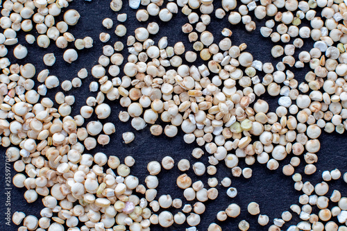 Fényképezés quinoa croup  on black surface close up