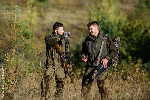 Military uniform fashion. Hunting skills & weapon equipment. How turn hunting into hobby. Friendship of men hunters. Man hunters with rifle gun. Boot camp. Army forces. Camouflage. hunter carry rifle.