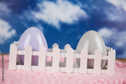 Easter, colorful eggs on a wooden table.