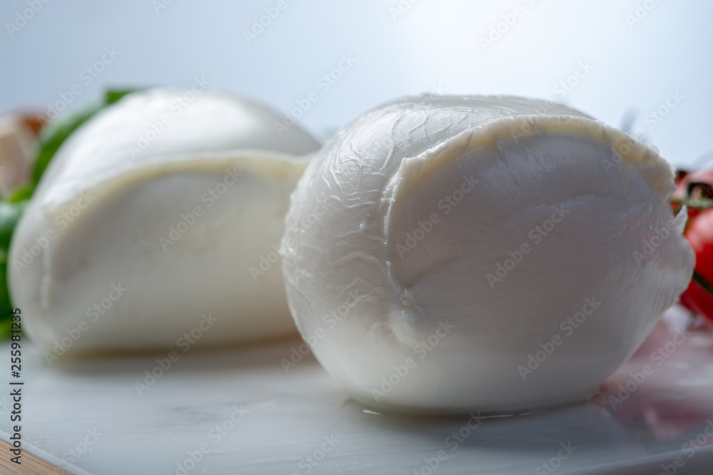 Balls of buffalo mozzarella, soft Italian scheese made from the milk of Italian Mediterranean buffalo