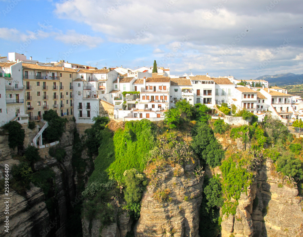 Houses os Ronda village in Spain in a sunny day over rocks