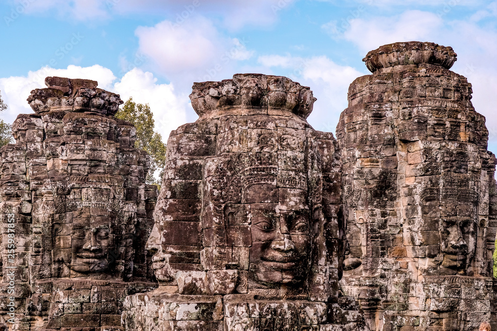 Detail of Ancient temple name Bayon Angkor with stone faces Siem Reap, Cambodia. Bayon's most distinctive feature is the multitude of serene and smiling stone faces on the many towers 