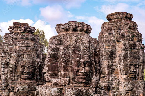 Detail of Ancient temple name Bayon Angkor with stone faces Siem Reap, Cambodia. Bayon's most distinctive feature is the multitude of serene and smiling stone faces on the many towers 