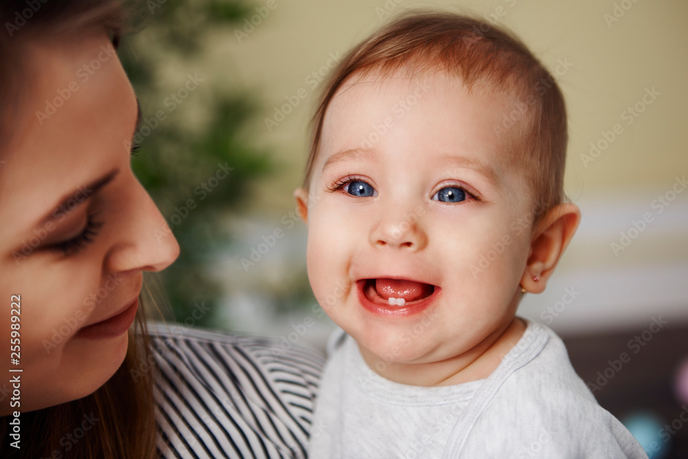 Cute baby girl showing her primary teeth Cute baby girl showing her primary teeth
