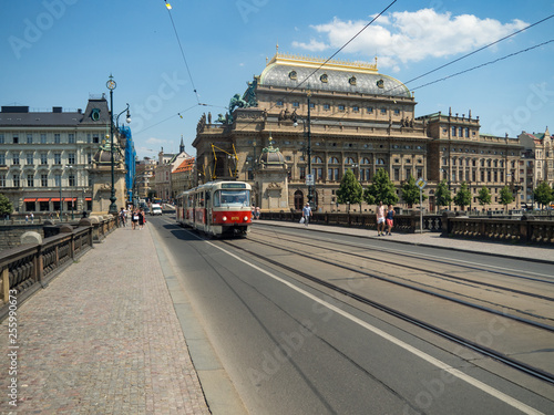Canvas Print PRAGUE, CZECH REPUBLIC - August, 2018: Red tram at old street in historical Cent