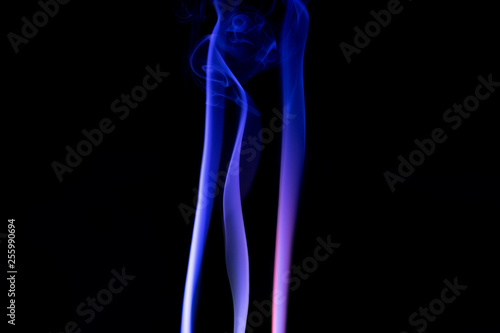 Abstract backgrounds and wallpapers. Colorful smoke on black background.
