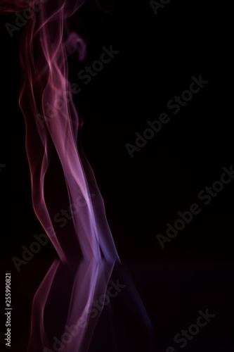 Abstract backgrounds and wallpapers. Colorful smoke on black background.