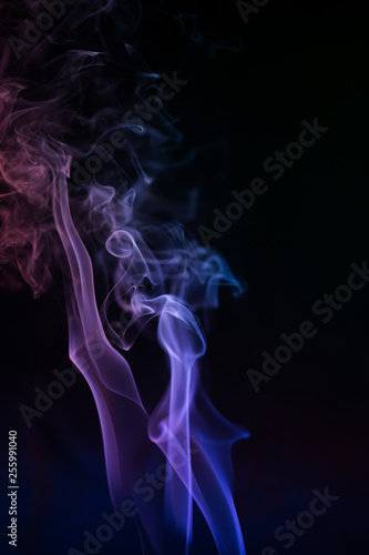 Abstract backgrounds and wallpapers. Colorful smoke on black background.