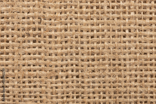 Close up on a burlap texture as abstract background. Copy space for your text.