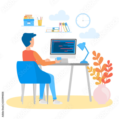 Porgrammer sitting at desk and working on laptop computer