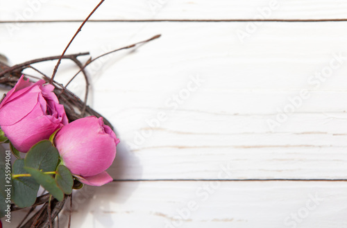 Creative flower bouquet on white wooden background. Mock up with copy space for greeting card, invitation, social media, Valentine's day, flower delivery, Mother's day, Happy Women's Day. Flat lay photo