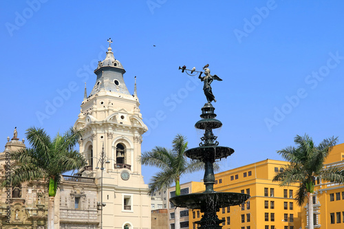 Historic Statue of Angel of the Fame on the Fountain at Plaza Mayor with Basilica Cathedral of Lima in the Backdrop, Lima, Peru