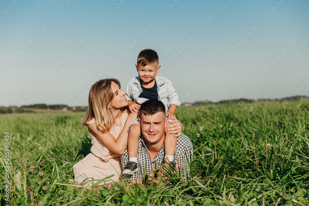 Parents and child on vacation playing together Parents and child on vacation playing together