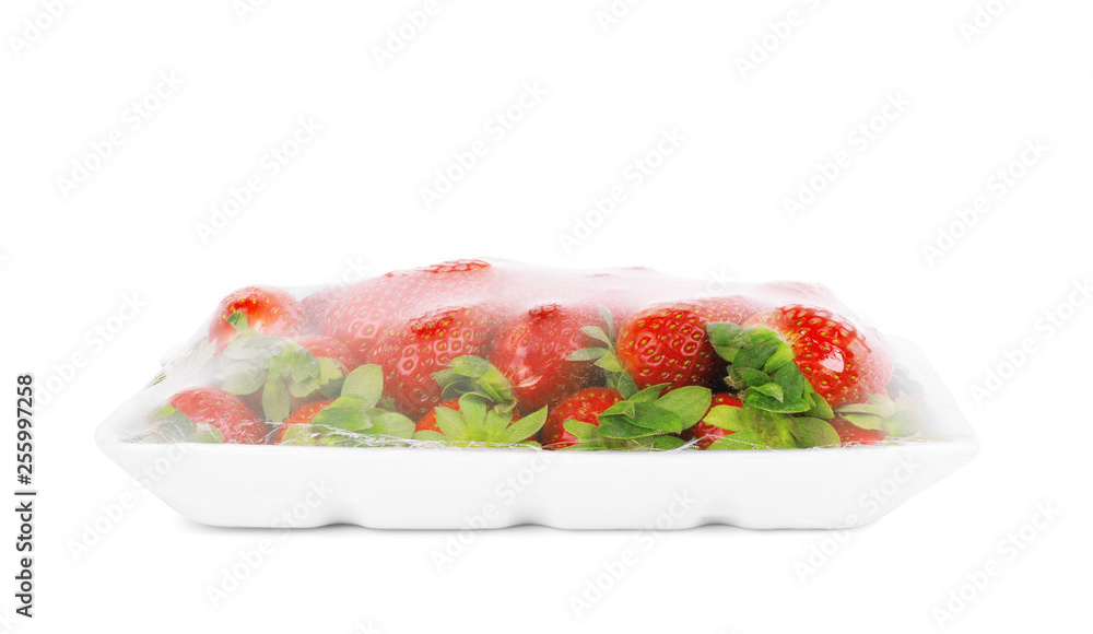 Fresh strawberries in a container on a white background Fresh strawberries in a container on a white background