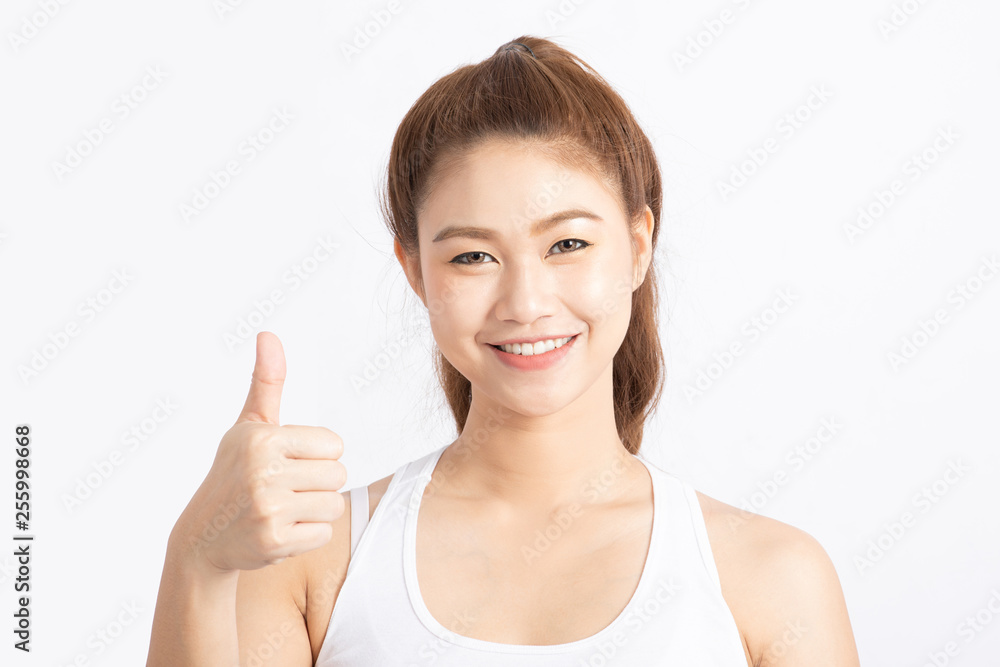 Beautiful Attractive Asian woman smile and showing thumbs up for good hand sign feeling so happiness and confident,Isolated on white background,Beauty concept Beautiful Attractive Asian woman smile and showing thumbs up for good hand sign feeling so happiness and confident,Isolated on white background,Beauty concept