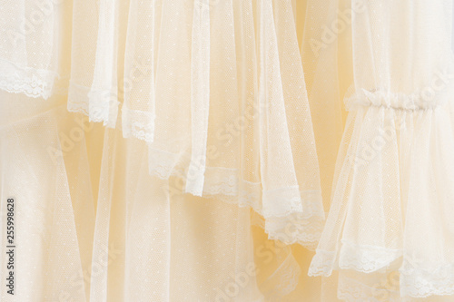 Beautiful handmade white wedding dress. Material closeup background.