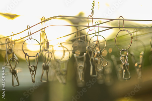 clothespins hanging on a clothesline : abstract background