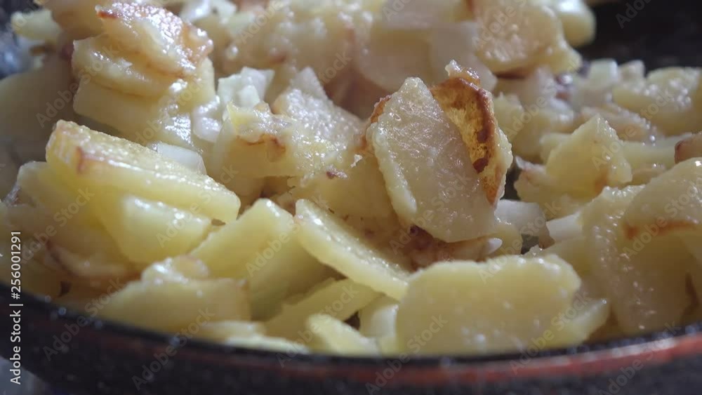Homemade fried potatoes in the home kitchen Homemade fried potatoes in the home kitchen