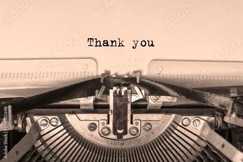 thank you printed on a sheet of paper on a vintage typewriter. writer.