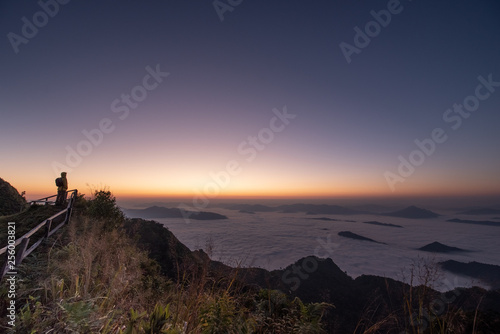 Chiang rai "Phu chee dao" famous mountain viewpoint for tourist with morning sunrise landscape.Doi pha tung located between "phu chee fah" and "Doi Pha tung" mountain in Wiang Kaen ,thailand