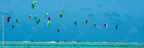 People practicing kitesurfing on a beautiful summer day - Caribbean - Archipelago of Los Roques - Venezuela