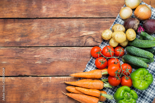 Fresh organic farm vegetables, Health care, on a wooden background. Harvest. Country style. Concept of a farm fair. Flat lay, top view. Copy space