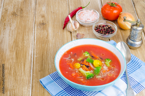 Spicy tomato soup with red peppers and vegetables.