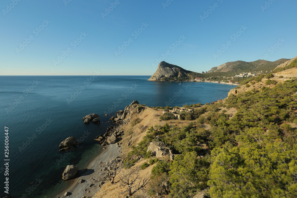beautiful landscape of gorgeous nature, coast line with mountains, horizon between sea and blue sky