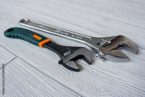 two adjustable wrenches on the table close up photo