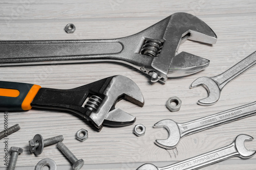 adjustable spanners and wrenches, nuts and bolts on the table photo