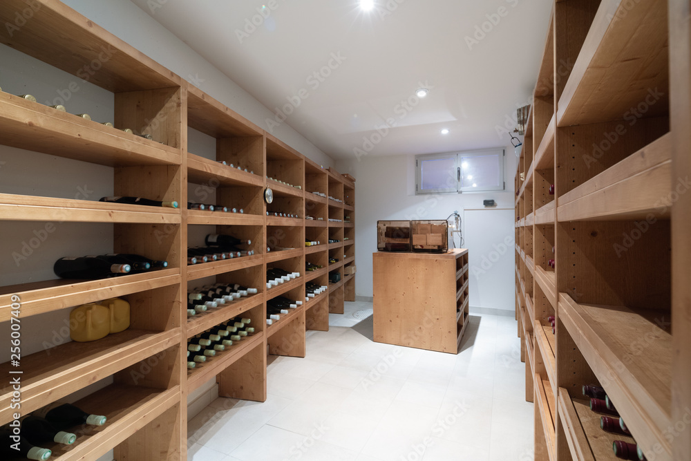 Wine cellar with bottles and cigar humidifier Stock Photo Adobe Stock