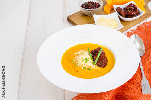 Delicious spicy pumpkin soup with parmesan.