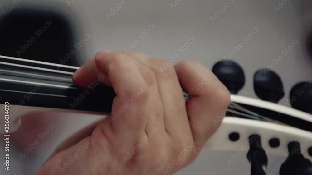 close up view white violin in hands of talented woman musician playing melody close up view white violin in hands of talented woman musician playing melody
