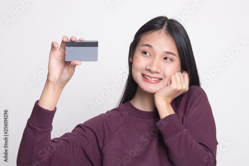 Happy young Asian woman with a blank card.