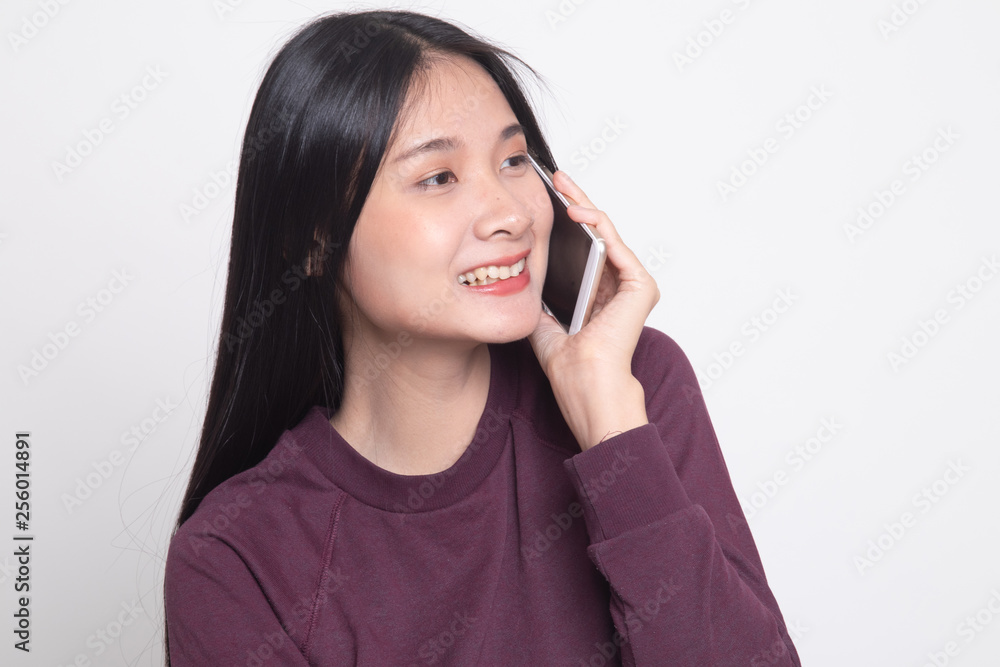 Young Asian woman talking with mobile phone. Young Asian woman talking with mobile phone.