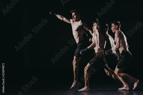 multiple exposure of strong barefoot muscular mma fighter doing punch in jump