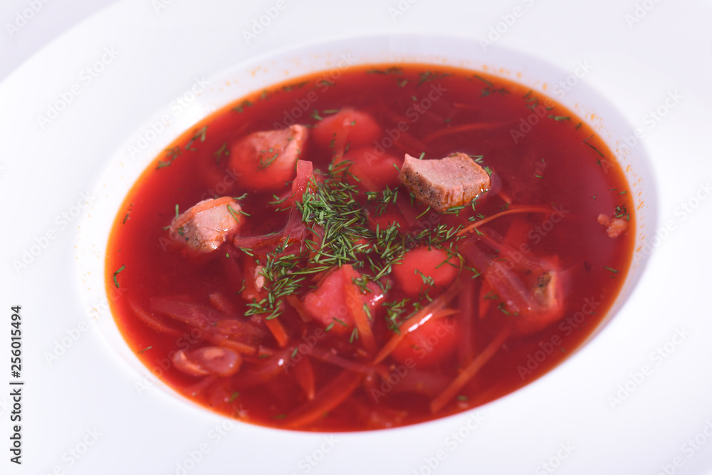 Borsch - traditional Ukrainian and Russian beetroot soup on white background. Borsch - traditional Ukrainian and Russian beetroot soup on white background.
