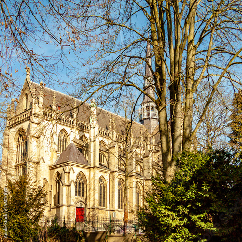 Beautiful side view of the Basilica of the Blessed Sacrament or Basilica of Meerssen seen from the Proosdij park, sunny winter day in South Limburg in the Netherlands Holland