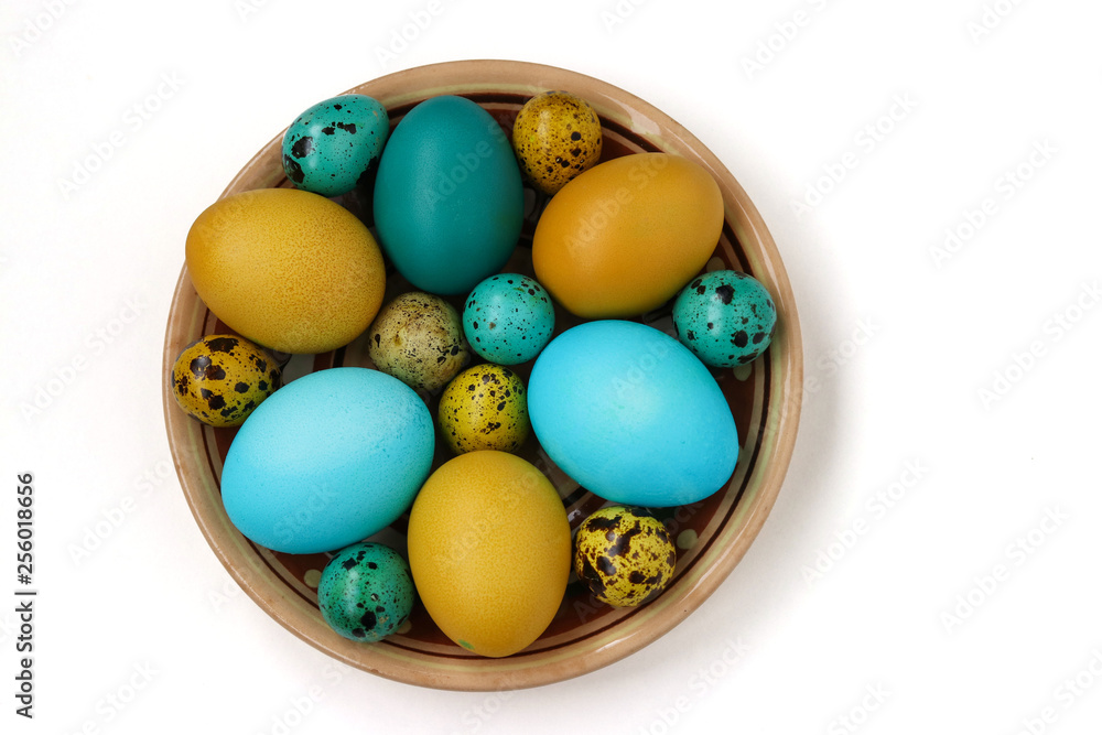 Yellow and blue chicken and quail eggs for Easter, Spring holiday concept Yellow and blue chicken and quail eggs for Easter, Spring holiday concept
